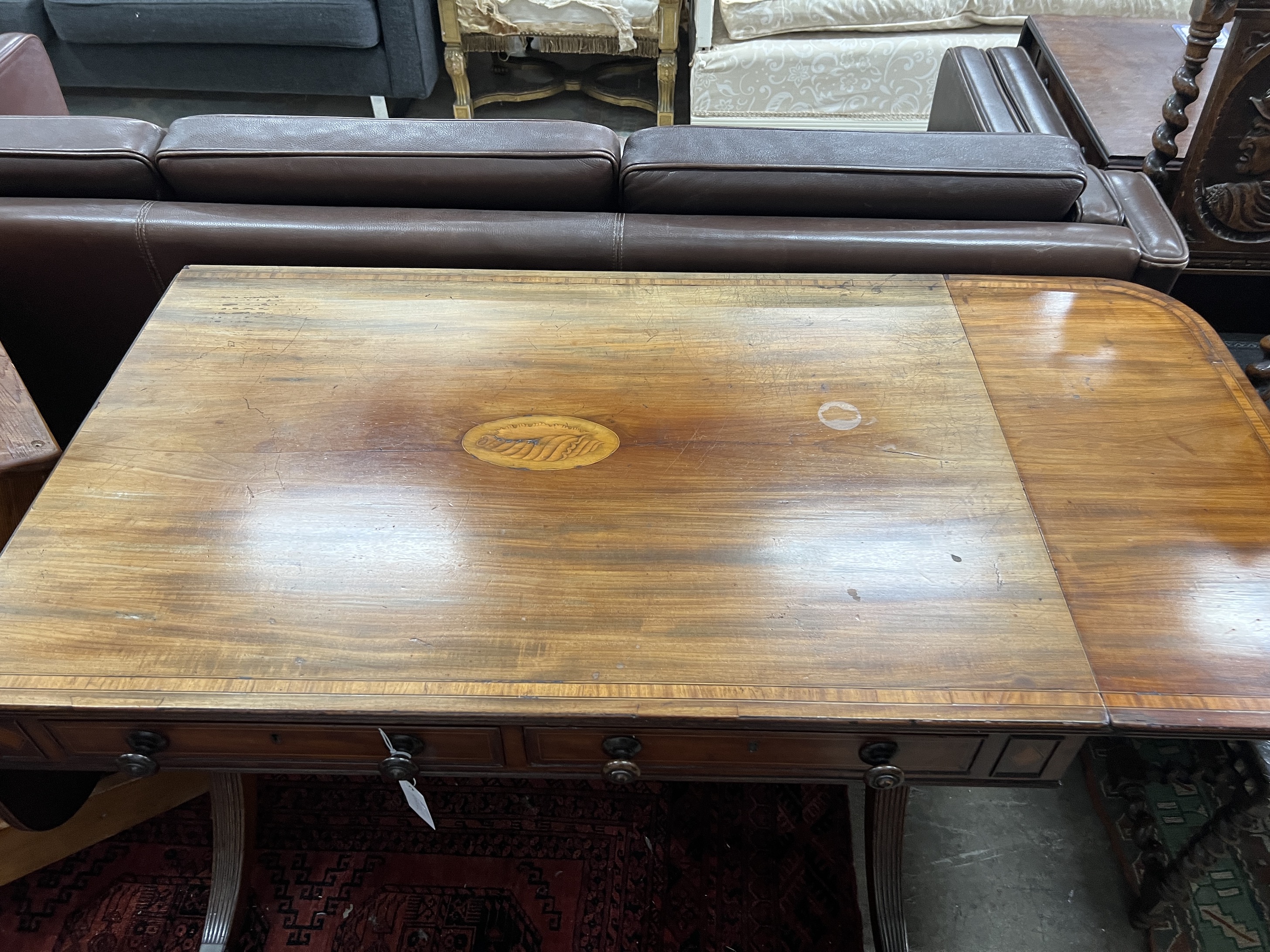 A George III satinwood banded and inlaid mahogany sofa table, width 97cm, depth 63cm, height 72cm